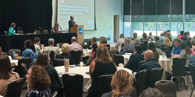 A crowded room of attendees at the Education Summit